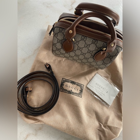 Gucci mini top handle bag. Like new- perfect condition. 
Dust bag included - Picture 5 of 7